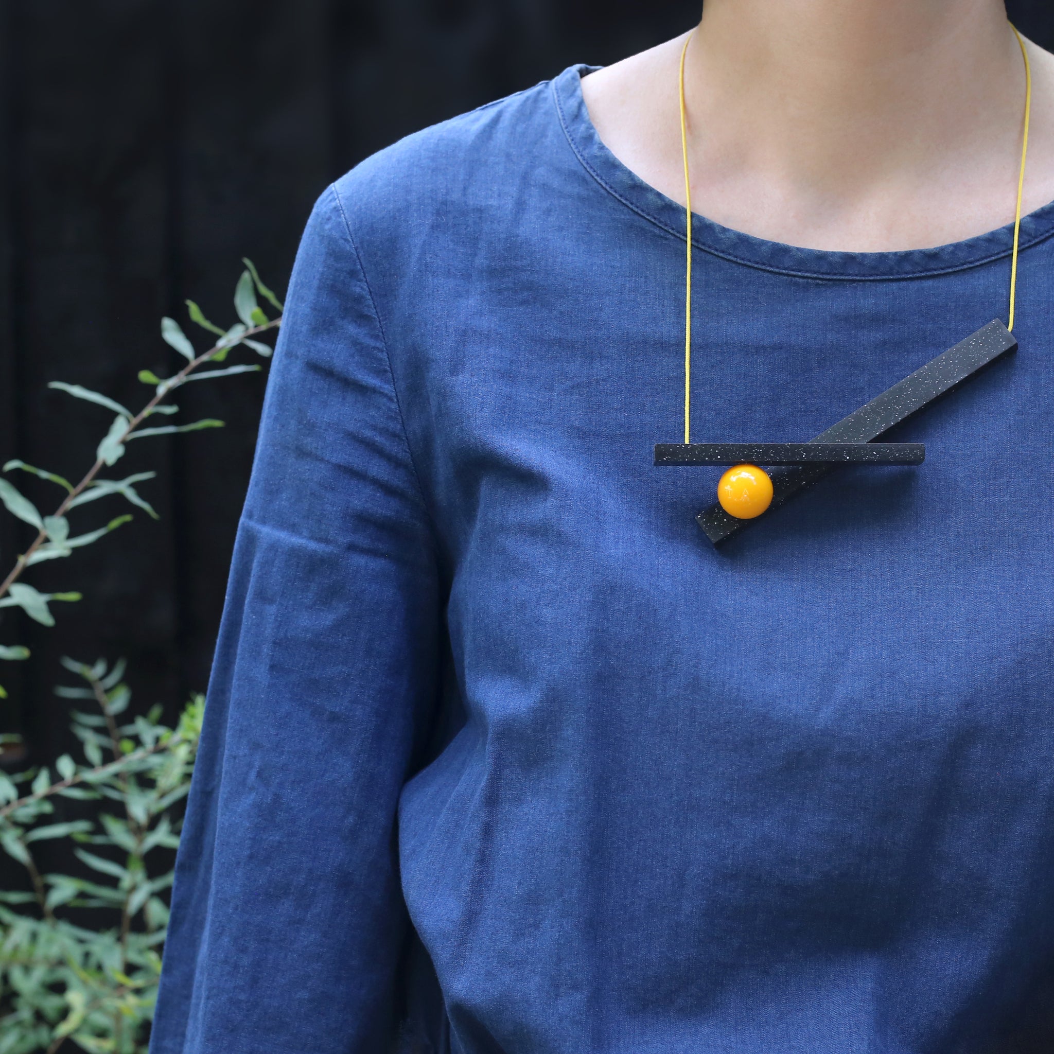 Van necklace by One We Made Earlier  worn on model.