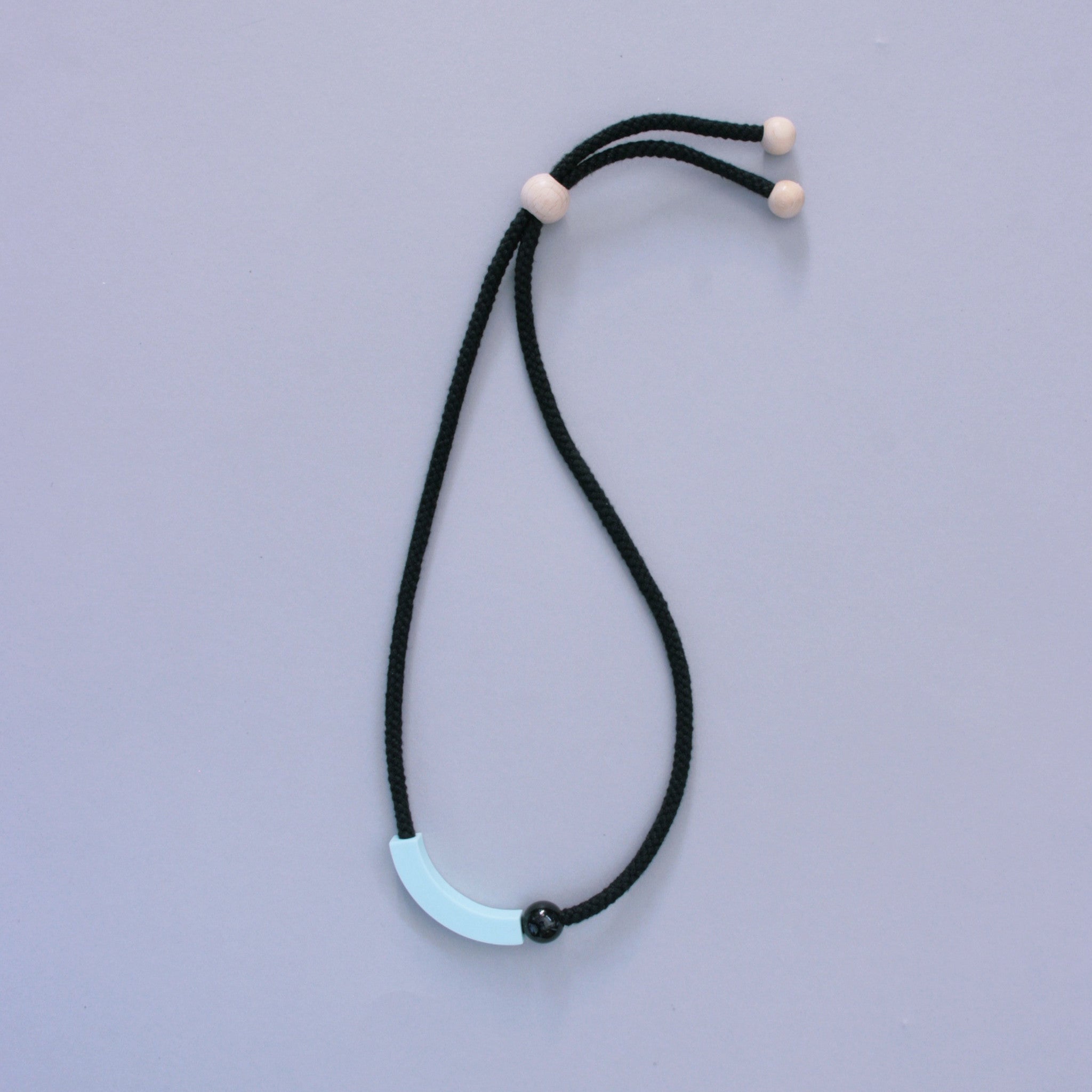 The Arp necklace is minimalist and striking. The mint resin curve sits off-centre beside a small black resin ball, offering a simple, but interesting design. The necklace is quite light, so very wearable. A contemporary design. Comes boxed in our branded kraft tube.