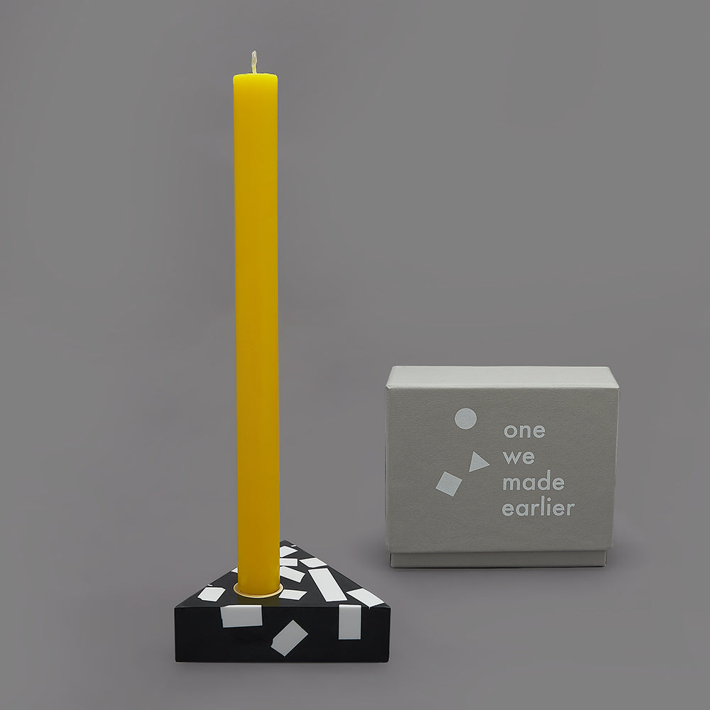 Each candle holder is hand made from black Jesmonite with graphic white chips. It has a fixed brass insert. Designs come packaged within a branded box. Subtle variations of white chip arrangement makes each piece unique. Product dimensions: 11cm x 11cm x 3cm Candle not included.
