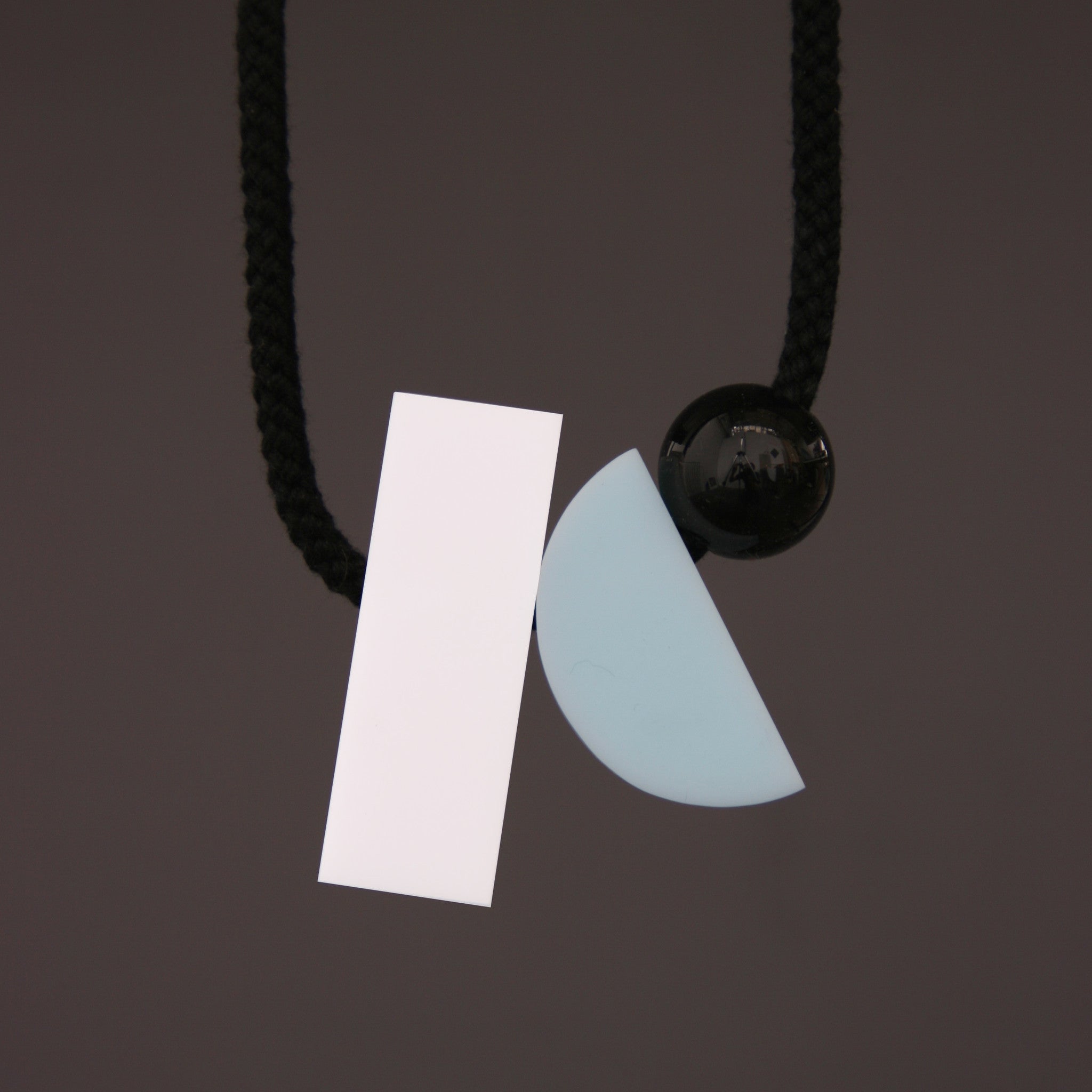 Image of Dora necklace with a white rectangle rather than pink.  Contemporary geometric necklace.