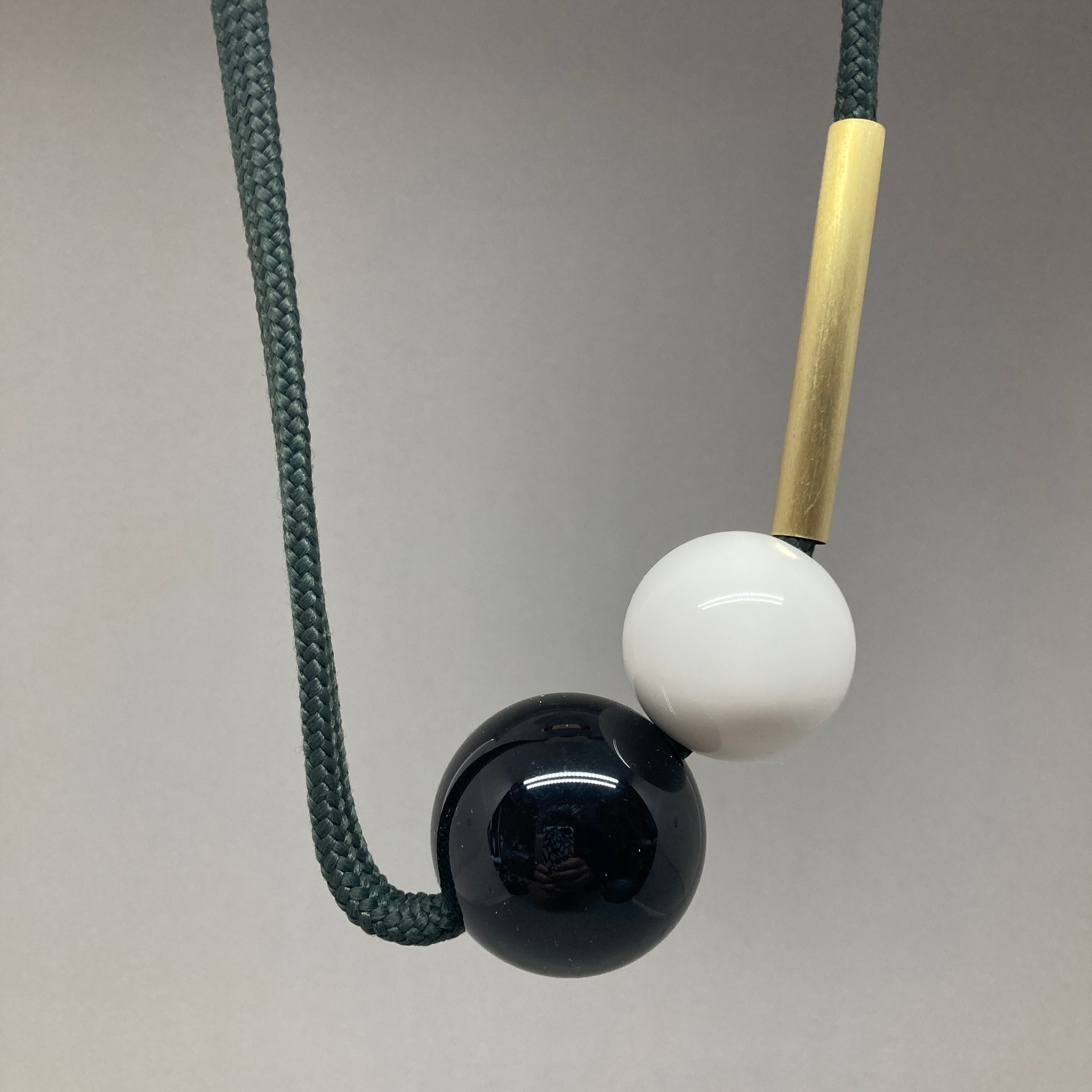 Sample necklace with short brass section