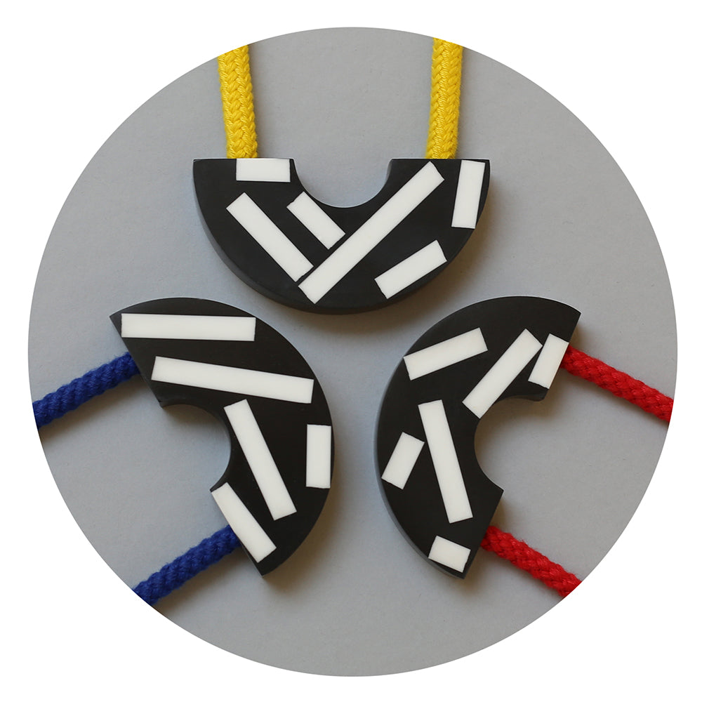 Say hello to our new Ito necklace! This handcast necklace is available with a yellow, red or blue cord. The black speckled curve is cast by hand in our studio using jesmonite meaning that each necklace is unique. The speckles are bold and white creating a striking design. 