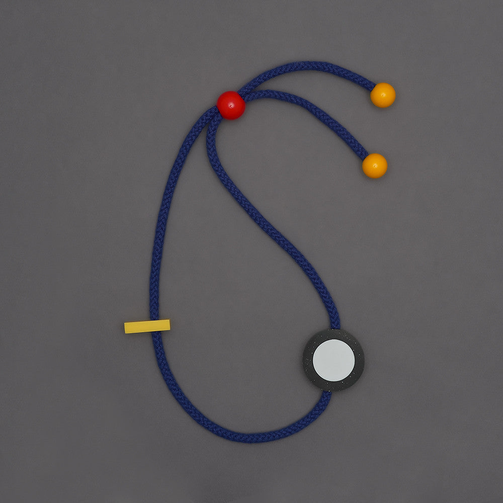 Pick is a bright and striking statement necklace with movable resin parts.Bright blue rope.